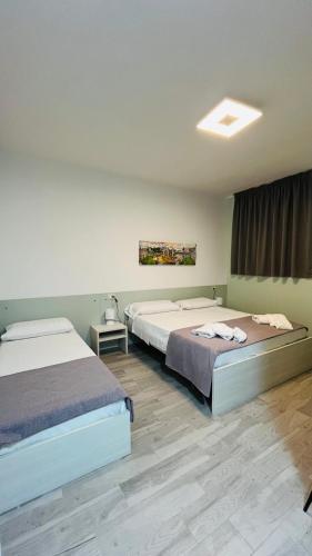 Postel nebo postele na pokoji v ubytování Hotel Montenuovo 44