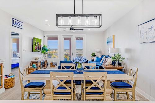 a dining room and living room with a table and chairs at Lakefront Horseshoe Bay Resort Shared Pool Dock in Horseshoe Bay