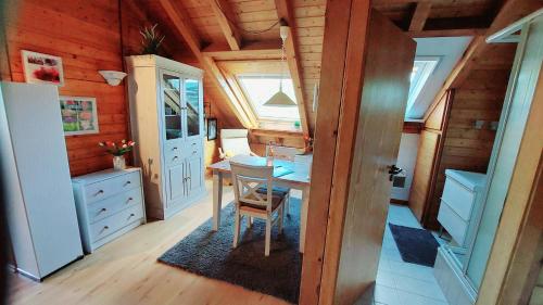 a small room with a table in a tiny house at Ferienwohnungen Sonnenhalde mit schöner Aussicht in Forbach