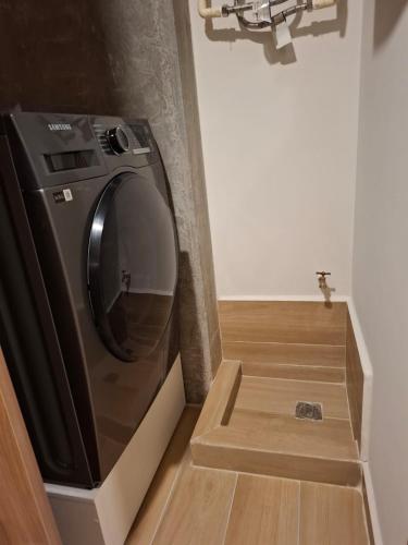 a washing machine in a box in a room at New 1-bedroom apartment Expo Guadalajara in Guadalajara