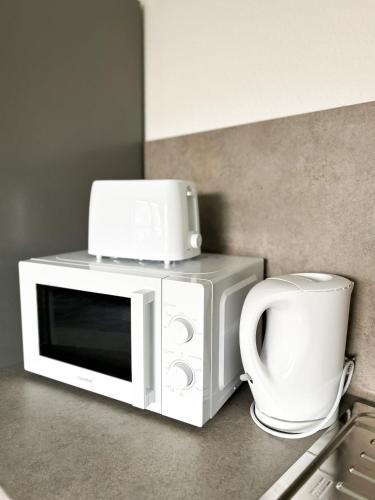 Kuchyň nebo kuchyňský kout v ubytování Ferienwohnung in Ahaus für 6 Gäste mit 2 Bädern und Loggia