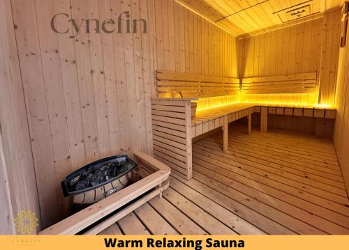 a sauna with a bench and a hot tub at Majestic Residence Kuala Lumpur near Bukit Bintang & Chow Kit in Kuala Lumpur
