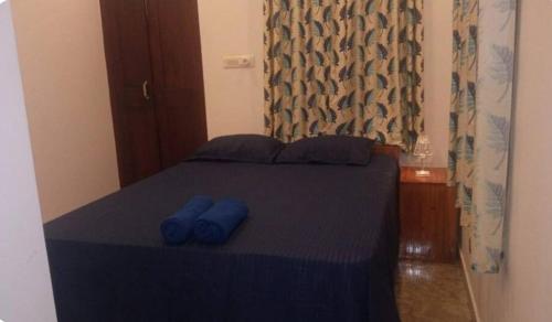 Postel nebo postele na pokoji v ubytování Kuttappy dreams