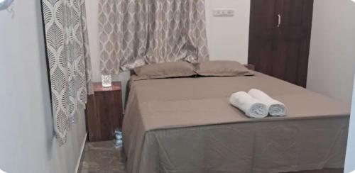 Postel nebo postele na pokoji v ubytování Kuttappy dreams