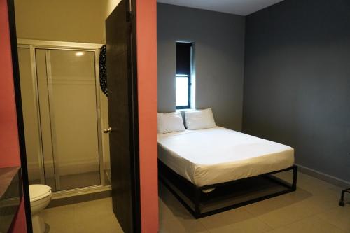 Ein Bett oder Betten in einem Zimmer der Unterkunft Estudios amueblados y equipados con cocineta en ubicación Céntrica MTY
