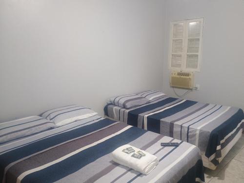 Postel nebo postele na pokoji v ubytování Apto aconchegante para descansar 03