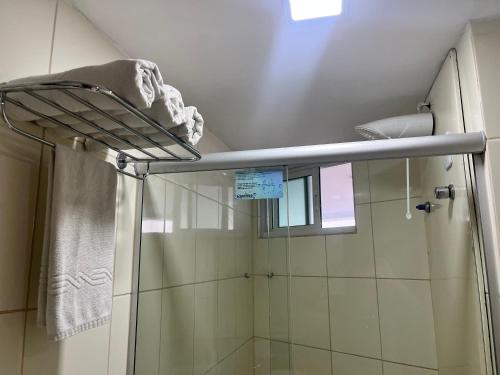 a shower in a bathroom with a shower curtain at Blue Sunset com Varanda - Experience in João Pessoa