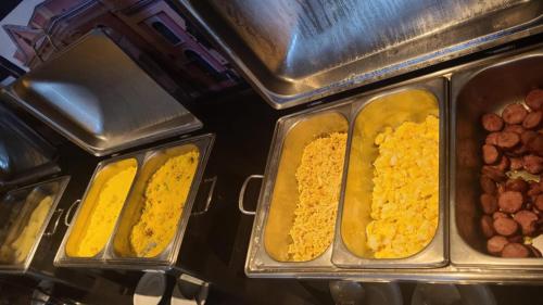 three trays of food with different types of food at Blue Sunset com Varanda - Experience in João Pessoa