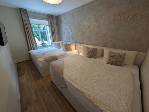 Un ou plusieurs lits dans un hébergement de l'établissement Apartmány penzion Jasmín
