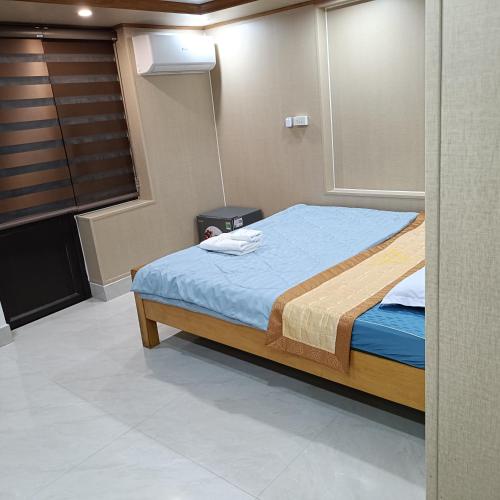 a bedroom with a large bed in a room at Quan Lan Nam Phong Hotel in Quan Lạn