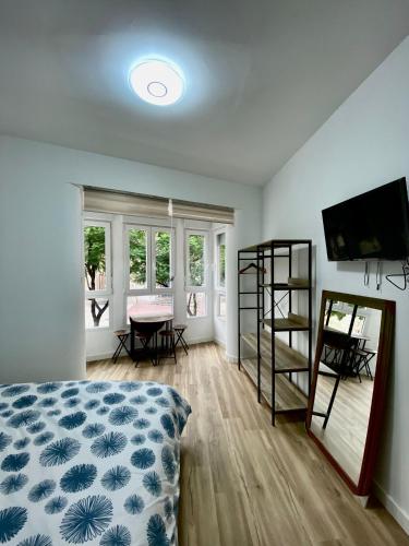 Ένα ή περισσότερα κρεβάτια σε δωμάτιο στο Apartamentos PIAS