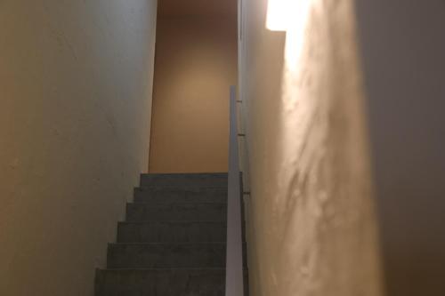 a stairway with a light on the side of a building at 2-times,Dormitory Hotel - Vacation STAY 55246v in Itoshima