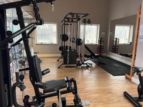a gym with several tread machines in a room at Lindo FLAT SP Jardins Ibirapuera com vaga inclusa in Sao Paulo