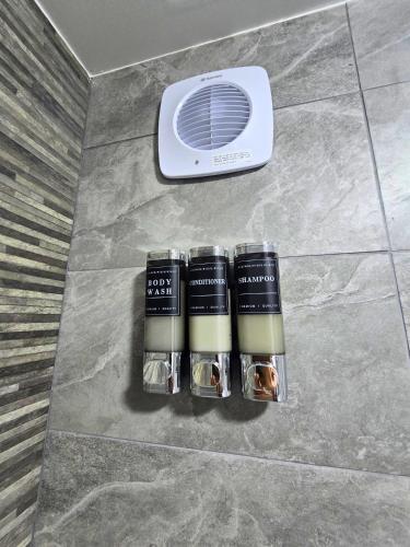 a air conditioner sitting on a floor next to a heater at Hertfordshire - Stylish 6BR Retreat, 3 Parking in Stevenage