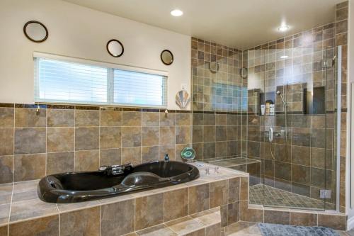 a large bathroom with a tub and a shower at Relax Explore from Mission Viejo Pool Spa in Mission Viejo