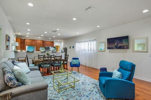 a living room with a couch and a dining room at Relax Explore from Mission Viejo Pool Spa in Mission Viejo