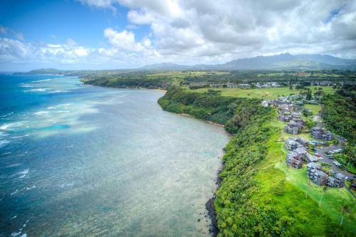 an aerial view of the shoreline of the ocean at Penthouse Condo with Panoramic Ocean Views in Princeville