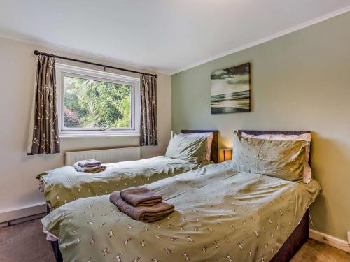 En eller flere senge i et værelse på 2 Bed in Clovelly FORDM