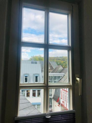 a window view of a city from a building at Moderne Fachwerk-Wohnung im Herzen von Herborn in Herborn