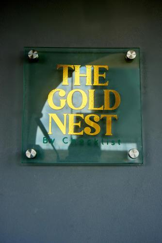 a sign that says the cold nest on a wall at THE NEST by CHECKLIST in Pakuro