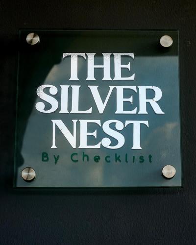 a sign that reads the silver nest by chexisting at THE NEST by CHECKLIST in Pakuro