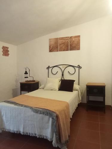 Ένα ή περισσότερα κρεβάτια σε δωμάτιο στο Casa de los Abuelos