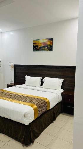 Katil atau katil-katil dalam bilik di Seasons Apartments