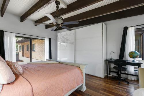 a bedroom with a bed and a ceiling fan at Pony Soldier Sedona Escape in Sedona