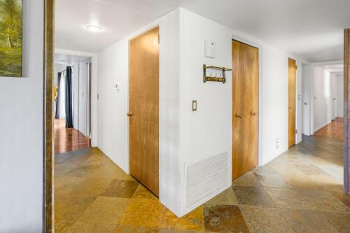 an empty hallway with white walls and wooden doors at Pony Soldier Sedona Escape in Sedona
