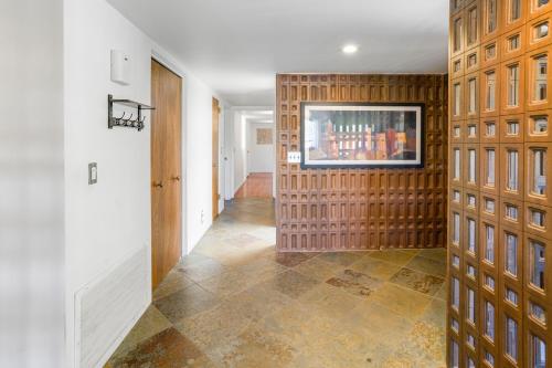 a hallway with a wall with a television on it at Pony Soldier Sedona Escape in Sedona