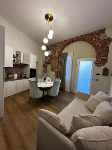 a living room and kitchen with a couch and a table at Casa Zoja 1 in Arona