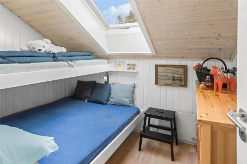 a small bedroom with a bed in a tiny house at L18-Rodby-Vibevej-9 in Rødby