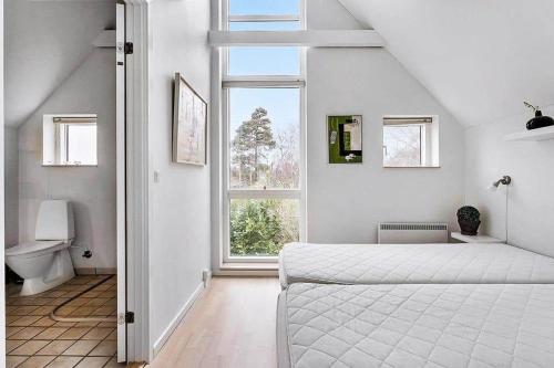 Ένα ή περισσότερα κρεβάτια σε δωμάτιο στο M13007-Vaeggerlose-Marielyst-Strandvej-63-Z