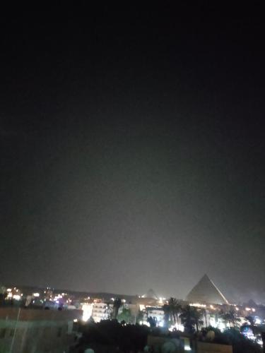 a view of the pyramids at night at Komaty pyramids view in Cairo