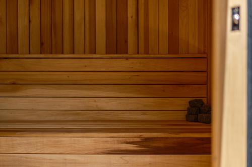 a wooden sauna with two rocks in it at Cholula Condesa Hotel by Lumina in Mexico City