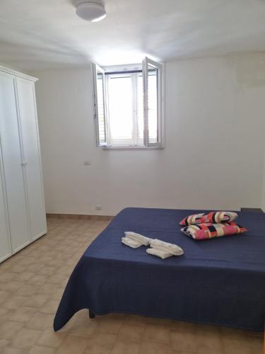 Ένα ή περισσότερα κρεβάτια σε δωμάτιο στο Affittacamere Eliana