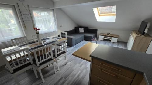 a small kitchen and living room with a couch at AlpenRide Ski & Bike Urlaub in Fliess