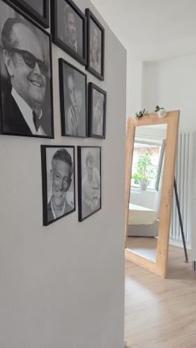 a group of pictures hanging on a wall at Freddie house in Albiano