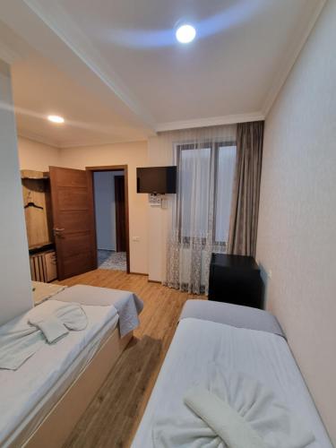Hotel Lotus Akhaltsikheにあるベッド