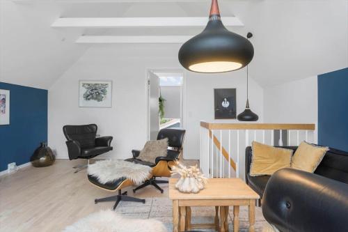 a living room with chairs and a couch and a table at M361-Vaeggerlose-Marielyst-Strandvej-63-U in Marielyst