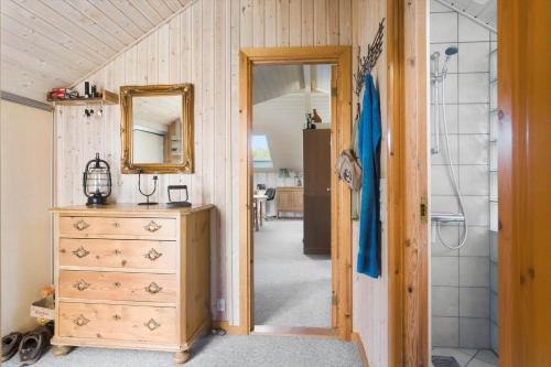 a bathroom with a sink and a dresser and a mirror at M365-Gedser-Lollandsvej-9 in Gedser