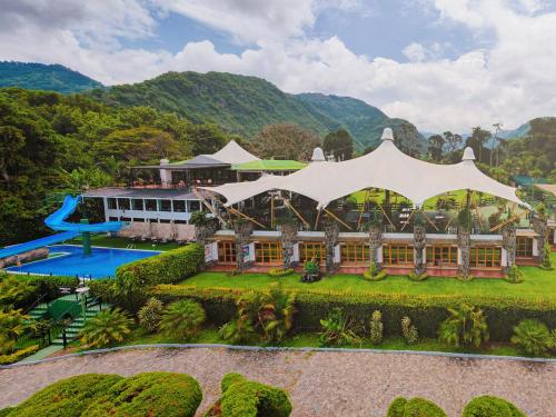 an aerial view of a resort with a pool at Hotel Posada de Don Rodrigo Panajachel in Panajachel