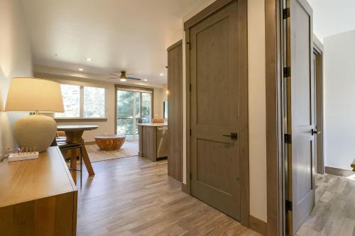 a hallway with a door leading to a living room at Romantic 1BR Getaway Across from Purgatory Resort in Durango Mountain Resort