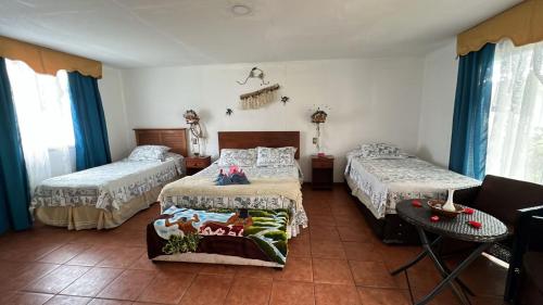 Ein Bett oder Betten in einem Zimmer der Unterkunft Hostal Harepakoba