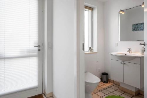 a bathroom with a toilet and a sink at M384-Vaeggerlose-Marielyst-Strandvej-63-B in Marielyst