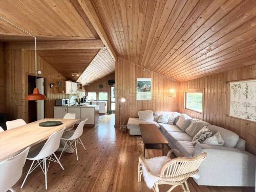 a living room with a couch and a table at M385-Vaeggerlose-Lupinvej-86 in Marielyst