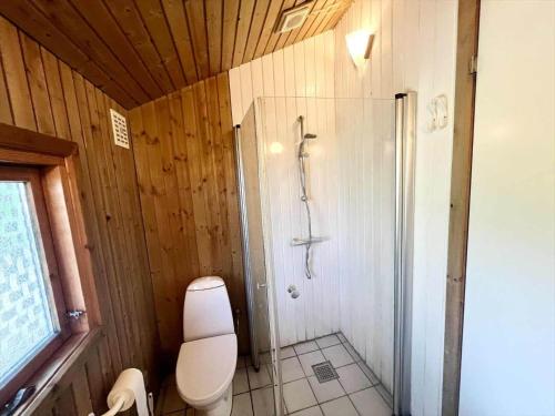 a bathroom with a shower and a toilet at M385-Vaeggerlose-Lupinvej-86 in Marielyst