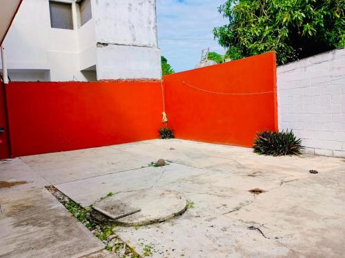 an orange fence in front of a building at Tuxpan AA 4Be 2B 2parking in Tuxpan de Rodríguez Cano