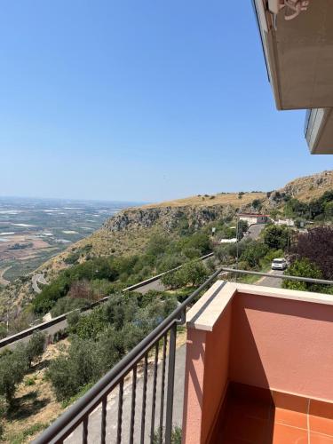 a balcony with a view of a mountain at Ninfa in Norma