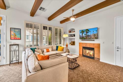 a living room with a couch and a fireplace at Spectacular Desert Retreat in La Quinta #A in La Quinta
